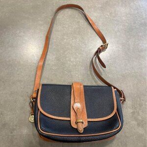 Vintage DOONEY & BOURKE bag. Unique closure. Brass hardware. True navy/brown.